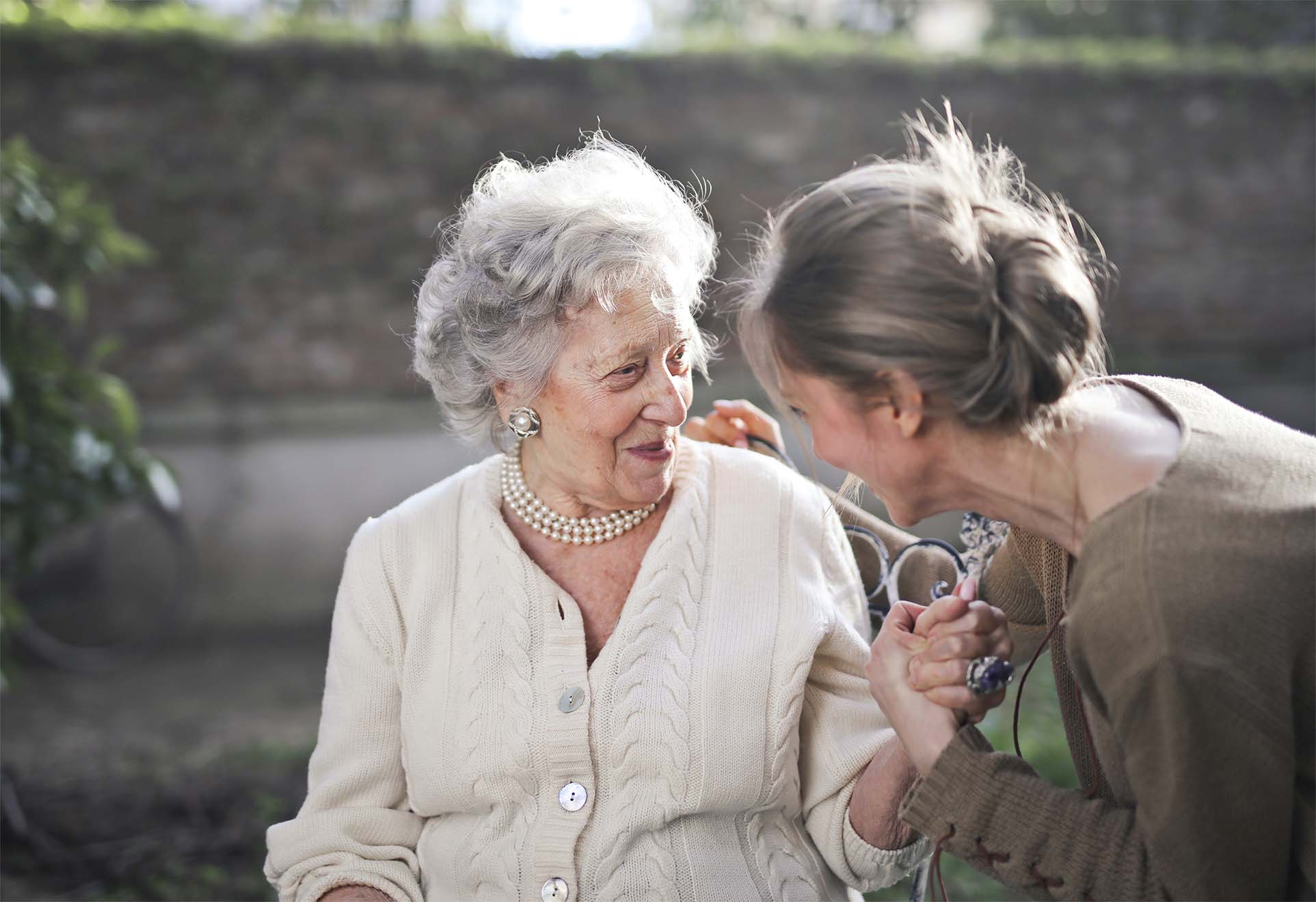 resident smiling with carer