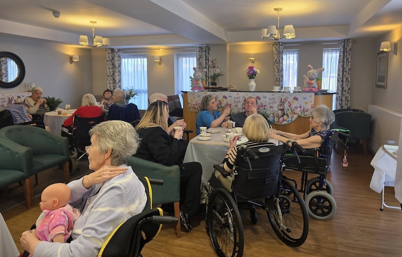 residents all sat around tables together chatting